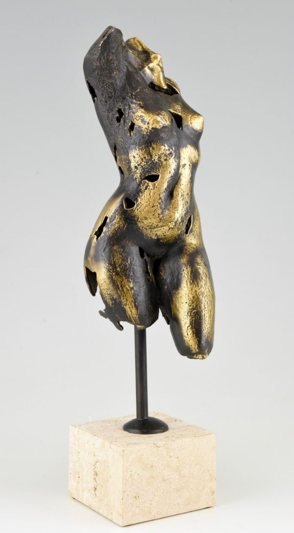 Bronze sculpture of a female torso.