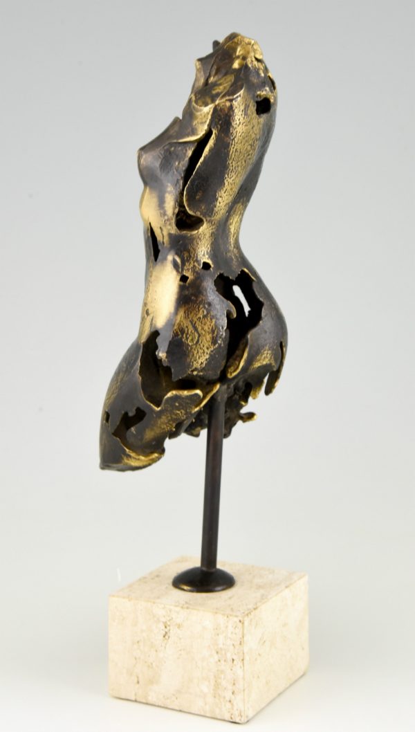 Bronze sculpture of a female torso.