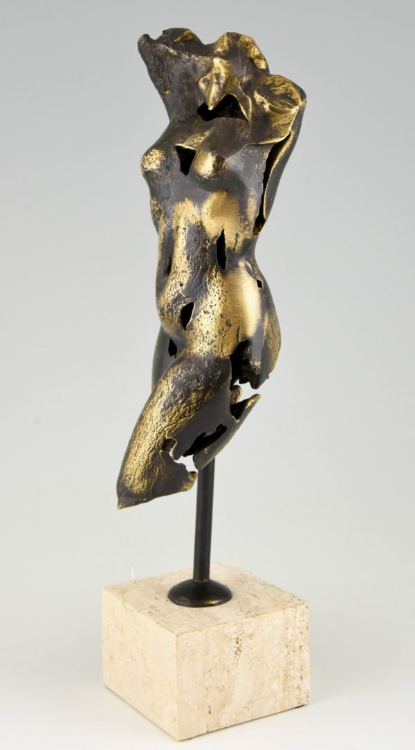 Bronze sculpture of a female torso.