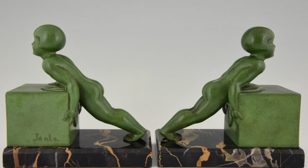 A pair of Art Deco child bookends.