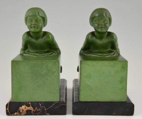 A pair of Art Deco child bookends.