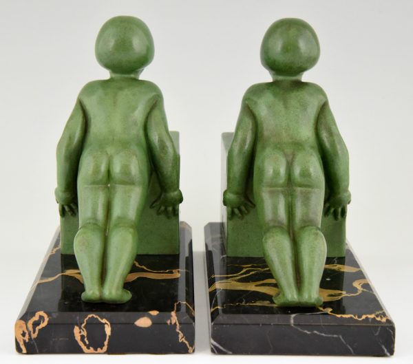 A pair of Art Deco child bookends.