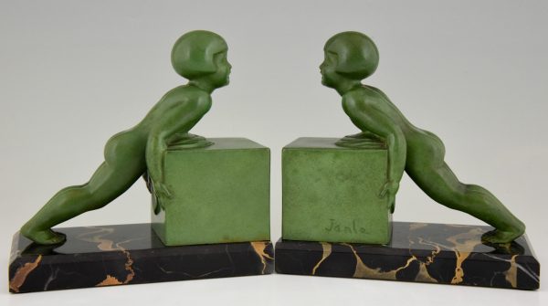 A pair of Art Deco child bookends.