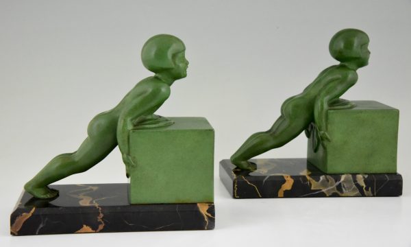 A pair of Art Deco child bookends.