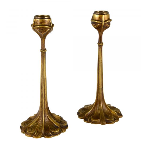 A pair of Art Nouveau bronze candlesticks