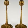 A pair of Art Nouveau bronze candlesticks