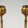 A pair of Art Nouveau bronze candlesticks