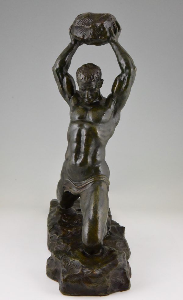 Art Deco bronze of male nude athlete with rock.