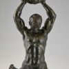 Art Deco bronze of male nude athlete with rock.
