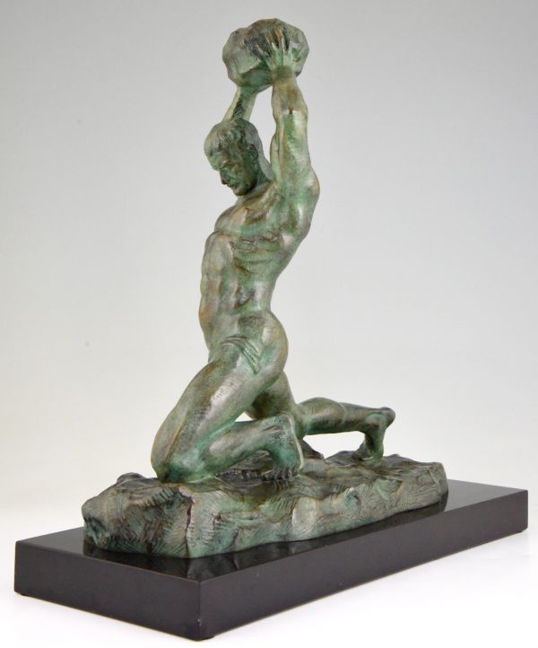 Art Deco bronze sculpture male nude athlete with rock.