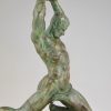 Art Deco bronze sculpture male nude athlete with rock.