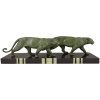 Art Deco sculpture of two walking panthers.