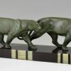 Art Deco sculpture of two walking panthers.