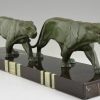 Art Deco sculpture of two walking panthers.