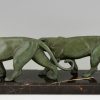 Art Deco sculpture of two walking panthers.