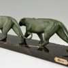 Art Deco sculpture of two walking panthers.