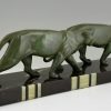 Art Deco sculpture of two walking panthers.