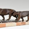 Art Deco sculpture of two walking panthers.