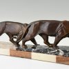 Art Deco sculpture of two walking panthers.