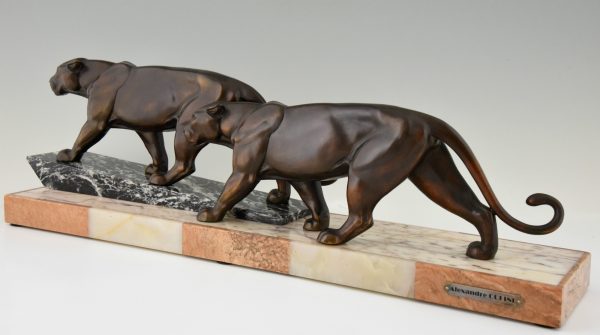 Art Deco sculpture of two walking panthers.