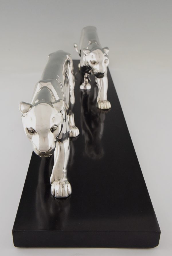 Art Deco silvered sculpture of two panthers