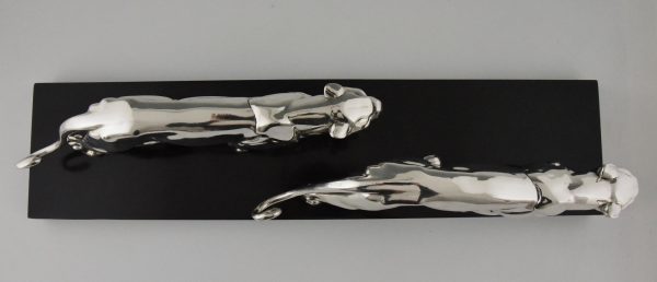 Art Deco silvered sculpture of two panthers