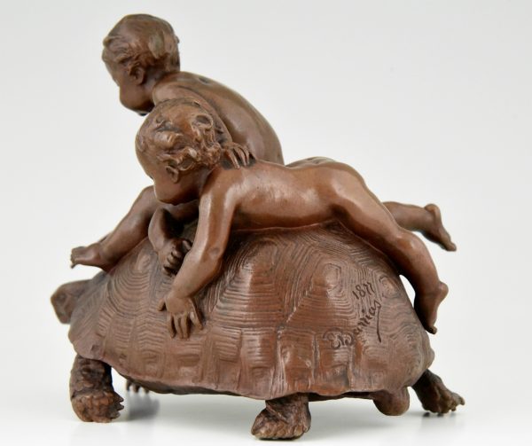 Antiek bronzen beeld 2 kindjes op een schildpad