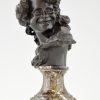 Antique bronze bust of a smiling child