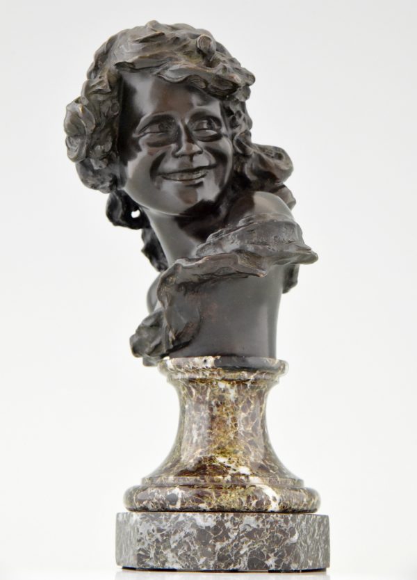 Antique bronze bust of a smiling child