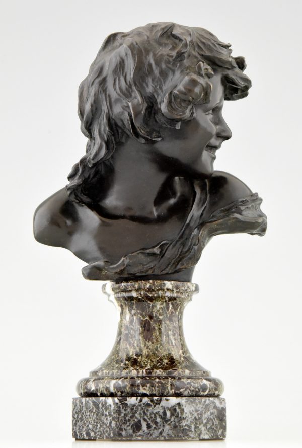 Antique bronze bust of a smiling child