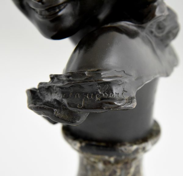 Antique bronze bust of a smiling child