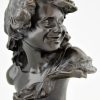 Antique bronze bust of a smiling child