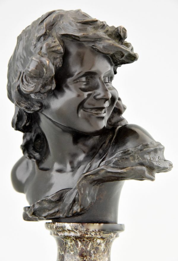 Antique bronze bust of a smiling child