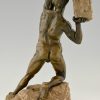 Antique bronze sculpture male nude with rock