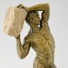 Antiek bronzen beeld mannelijk naakt met steen