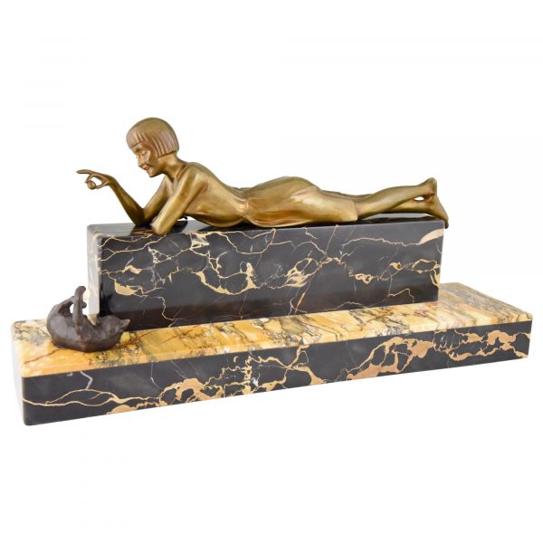 Art Deco bronze sculpture of a girl playing with a cat.