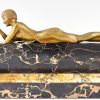 Art Deco bronze sculpture of a girl playing with a cat.