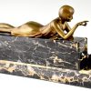 Art Deco bronze sculpture of a girl playing with a cat.