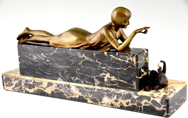 Art Deco bronze sculpture of a girl playing with a cat.