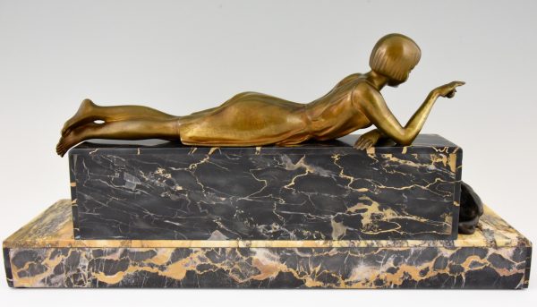 Art Deco bronze sculpture of a girl playing with a cat.