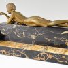 Art Deco bronze sculpture of a girl playing with a cat.