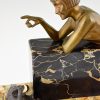 Art Deco bronze sculpture of a girl playing with a cat.