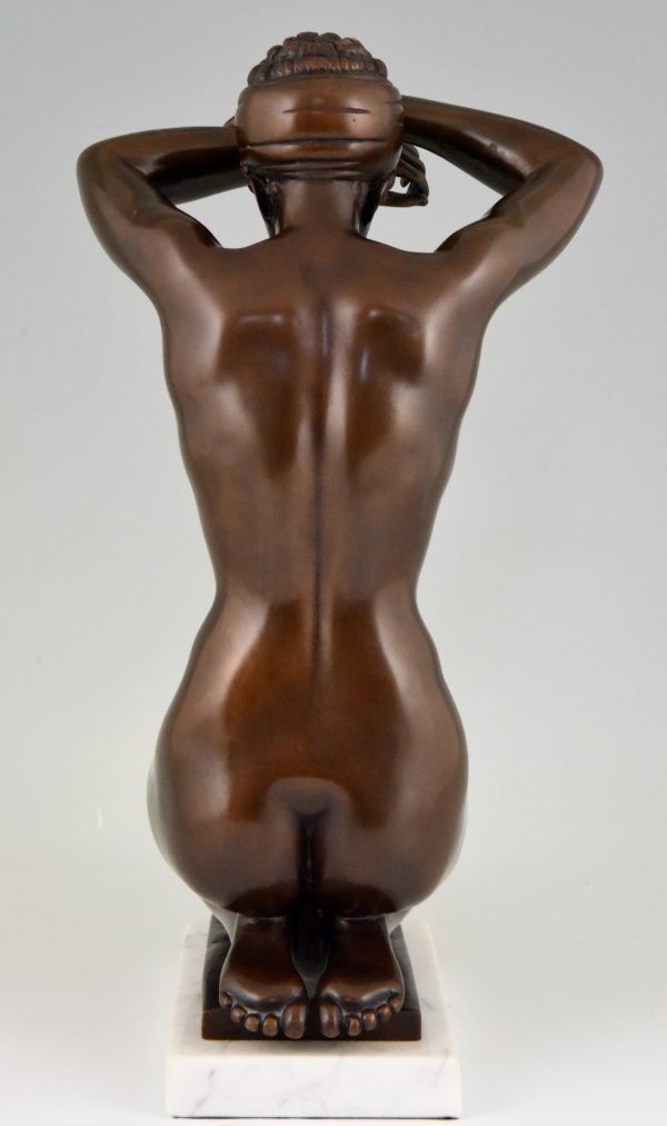 Bronze sculpture of a kneeling nude “Die Sinnende”