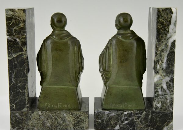 Art Deco bookends buddhist monks reading.