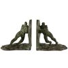 Art Deco bronzen boekensteunen duwende mannen