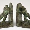 Art Deco bronzen boekensteunen duwende mannen