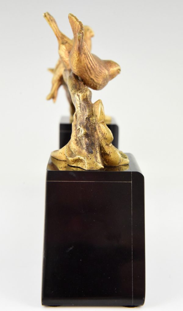 Art Deco bronzen beeld vogels op een tak.