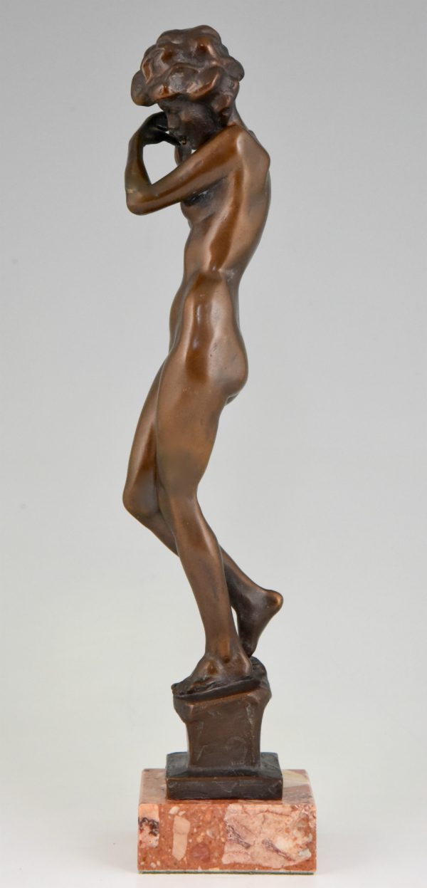 Art Deco bronze sculpture of a nude with flute.