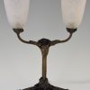 Art Deco table lamps on wrought iron bases.