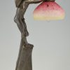 Art Nouveau lamp with boy sheltering under a leaf.